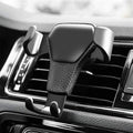 Black gravity phone mount fitted to a car air vent